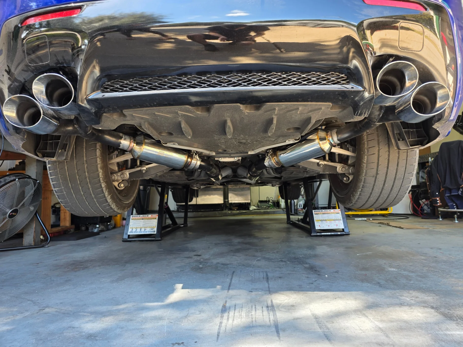 Custom fabricated dual exhaust installed on a Lexus RC F