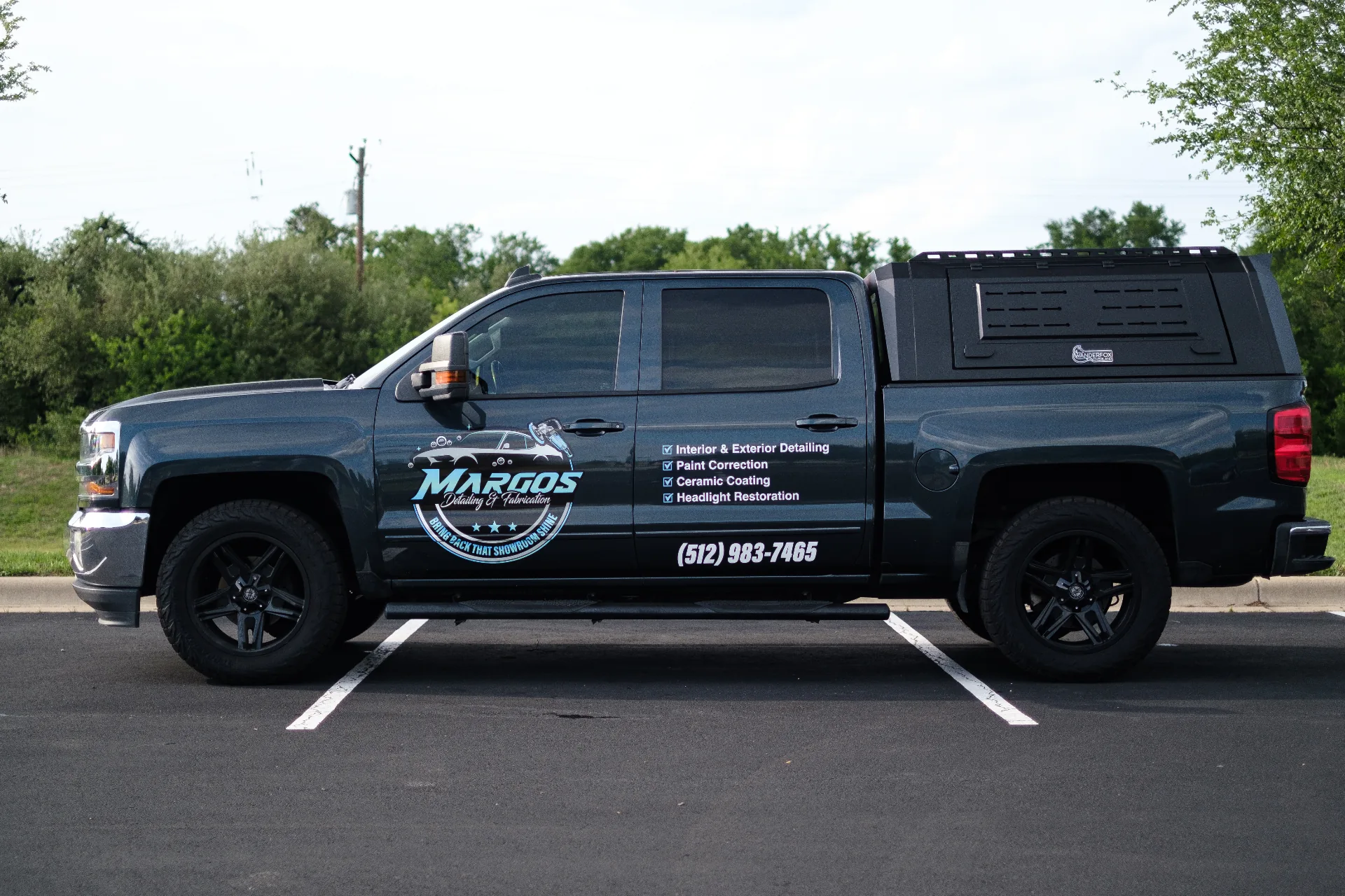 Margos Detailing & Fabrication branded truck with services listed
