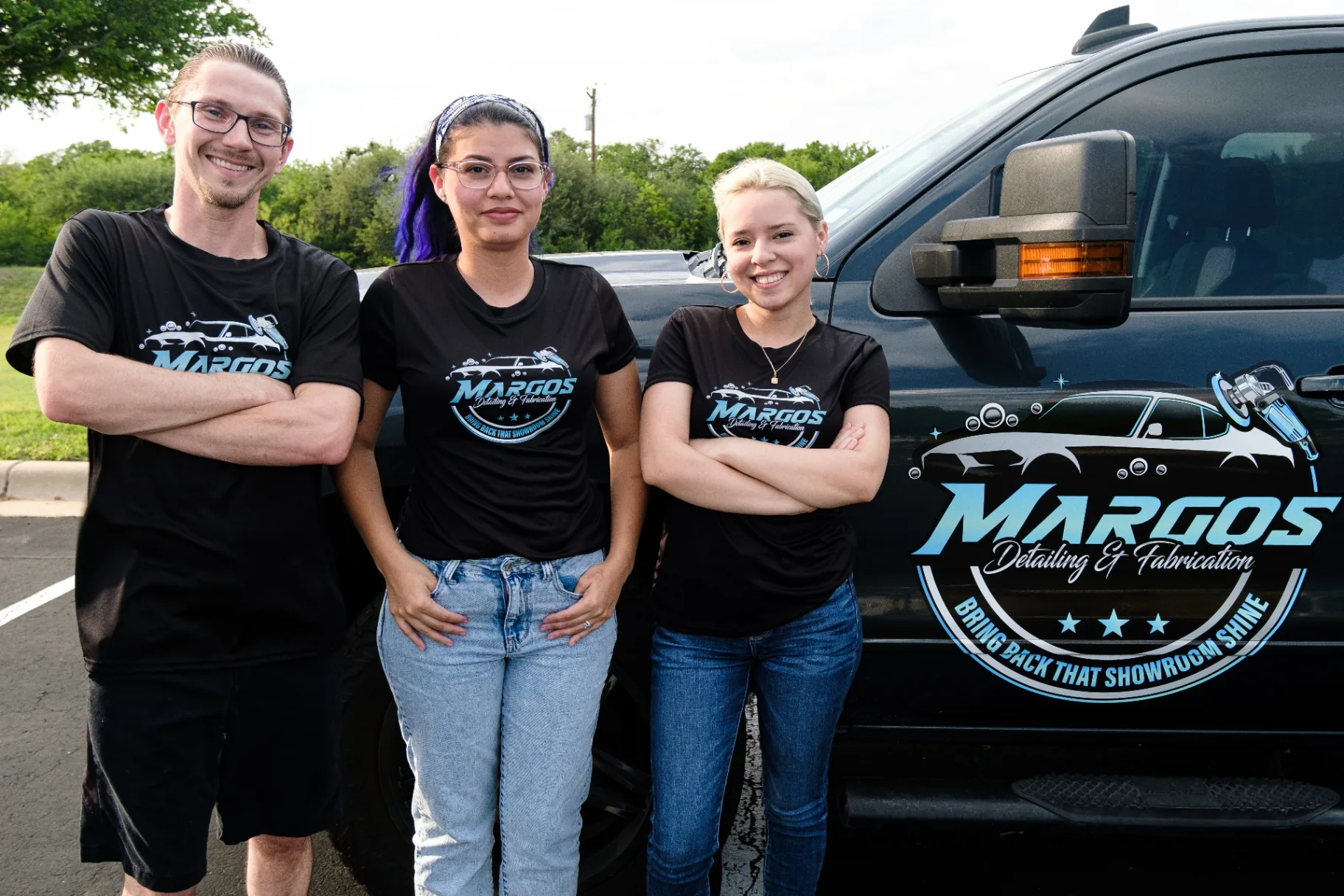 Gregory Margos and team standing beside the Margos Detailing & Fabrication truck